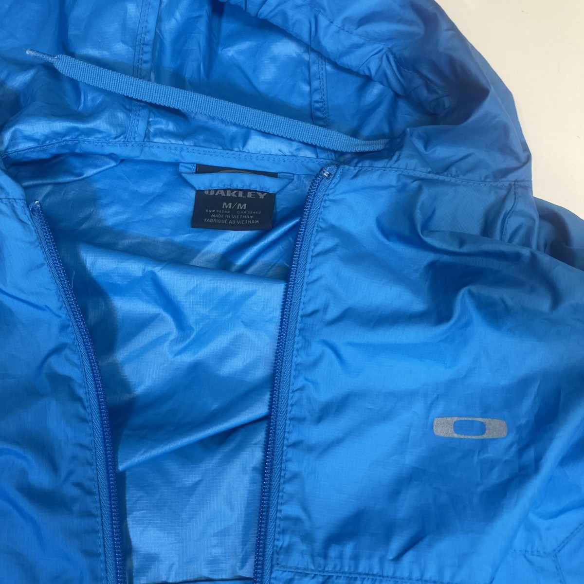 OAKLEY ジップナイロンジャケット　総柄ブルゾン　XL OAKLEY オークリー ジップ ナイロンジャケット 総柄 グリーン系 サイズ