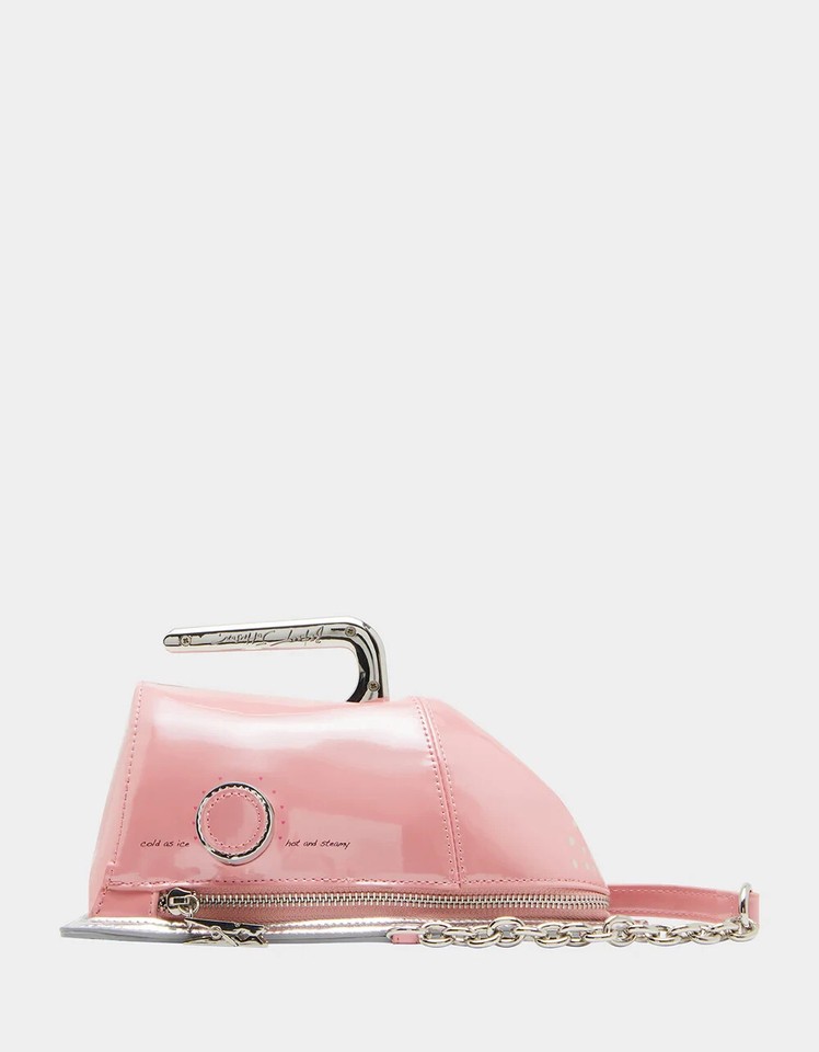 A Betsey Johnson crossbody shaped like an Iron Maiden — yes, the medieval torture device — in bubblegum pink with kitsch embellishments; absurdly specific and wildly giftable.