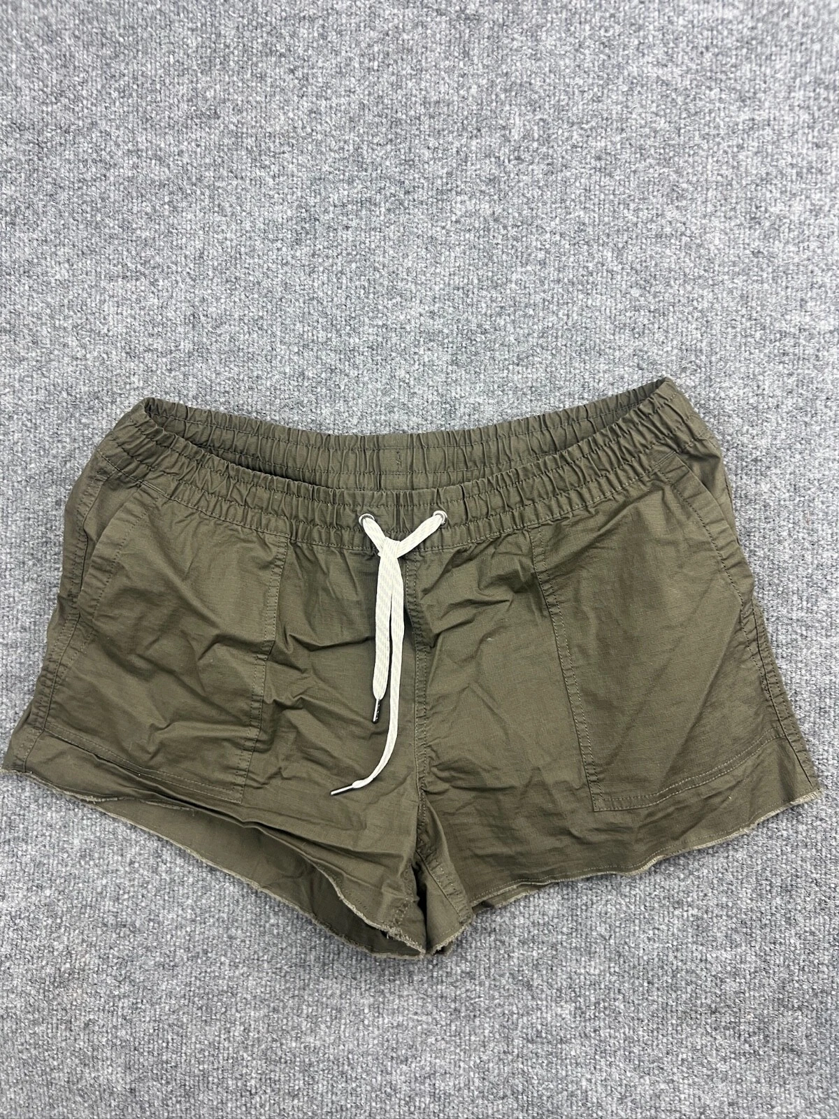 vuori drawstring elastic waist pockets raw hem zip pocket shorts