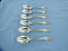 AN ANTIQUE SET OF SIX STERLING SILVER QUEENS PATTERN DESSERT SPOONS, LONDON 1869