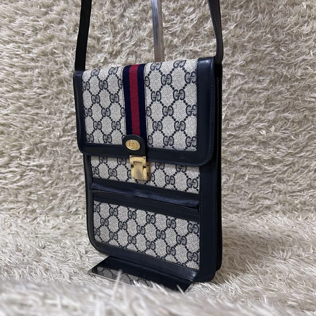 Sac à main créateur Gucci bandoulière motif Gg pvc bleu marine léger