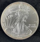 2011 American Silver Eagle, BU, 1 troy oz .999 silver, starting to tone, #0151