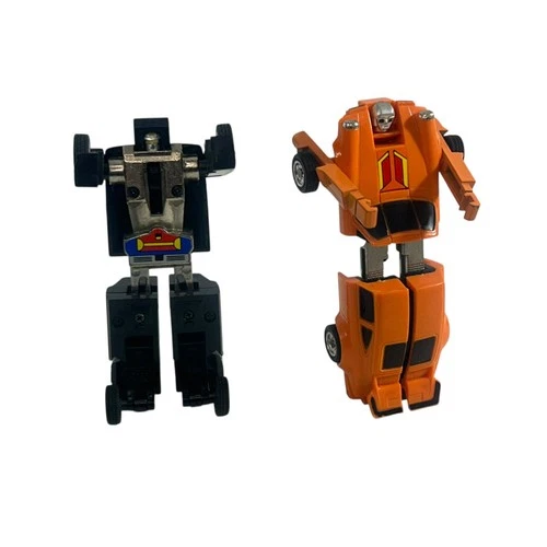 Lot Of (2) 1984 Bandai GoBots Rube-Mercedes Benz & Puzzler Crossword-Porsche