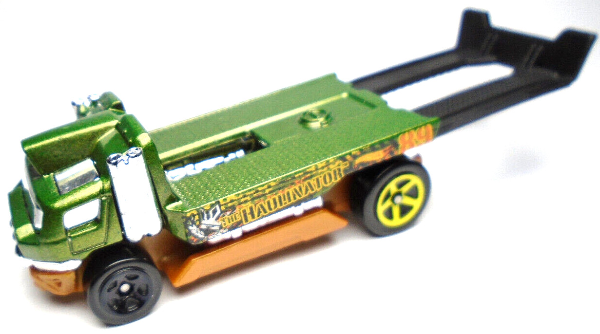 2015 HOT WHEELS THE HAULINATOR #89 GREEN 2 3/4" DIECAST TRUCK W ORANGE & YELLOW