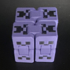 Minecraft Purple Creeper Face infinity cube fidget toy.