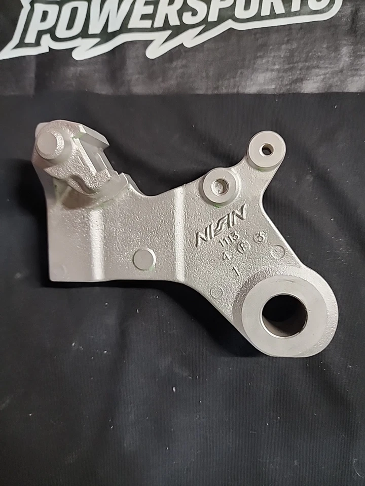 Soporte de pinza de freno trasero Kawasaki KX125 1995 OEM Nissin montaje limpio Foto 2 de 4