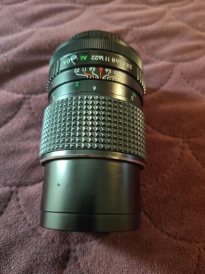 The Items shown In The Image Is a Vintage Alfo Supercolor MC Auto 135mmf/2.8