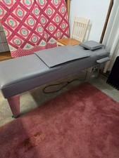 Chiropractic vibrating roller table.