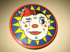 Litho Tin Toy Kirchhof CLOWN FACE WINKING EYE Ratchet Noisemaker - noise maker