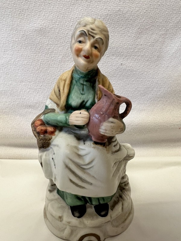 Vintage Artmark Ceramic Little Nana Sitting On A Bench Holding A Basket Of Apple