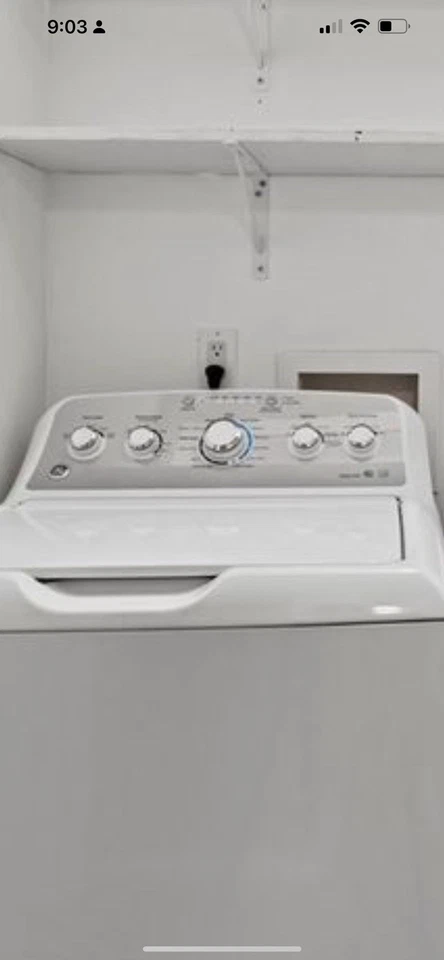 Juego combinado de lavadora y secadora GE Foto 3 de 4