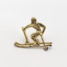 Vintage brass skier Lapel pin. Skiing. Gold Tone. Brand New Old Stock