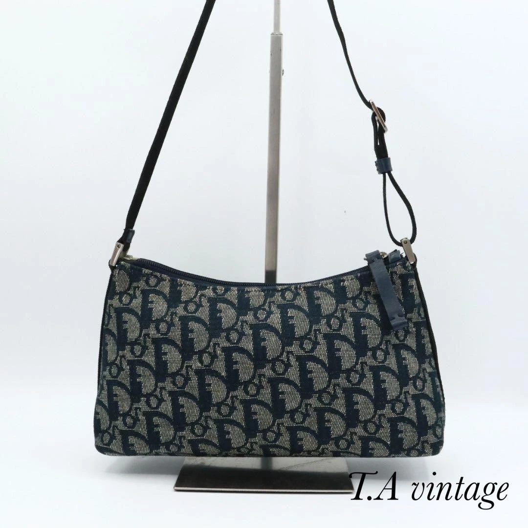 Sac à main Christian Dior trotteur toile bleu marine motif logo vintage 417M