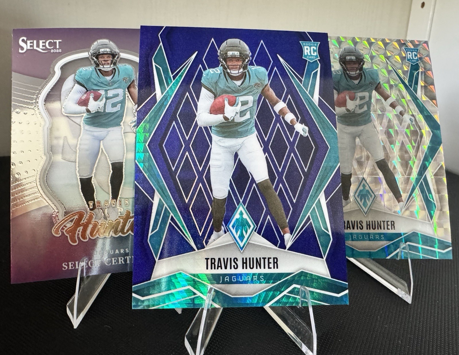 2025 Panini Phoenix-Travis Hunter #157 Blue Hyper /199 (RC) with Bonus Cards