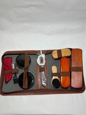 shoe care travel kit in a brown case