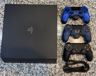 Pristine Playstation 4 Pro 1TB with (3) Controllers and (2) Control Attachments.