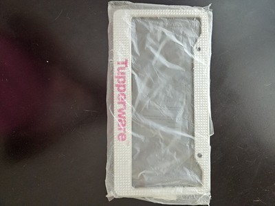 Tupperware  License Plate Frame With Rinestones