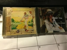 ELTON JOHN 2 CD LOT: GOODBYE YELLOW BRICK ROAD + GREATEST HITS