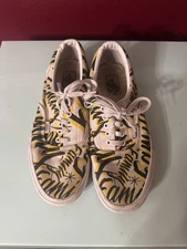 Vans Family Era low-top shoes with a white canvas upper and a black and yellow
