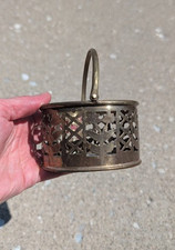 Vintage Brass Decorative Basket with a Hinged Handle and a Cutout Design