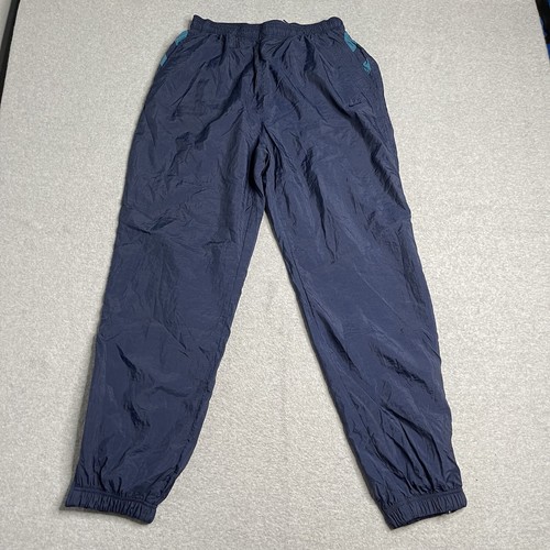 vintage nike 90s track pants white stripes swoosh embroidered blue