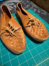 Brown woven leather lace-up flats