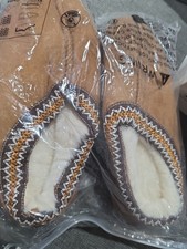 brown suede-style moccasin slippers featuring a cozy white...