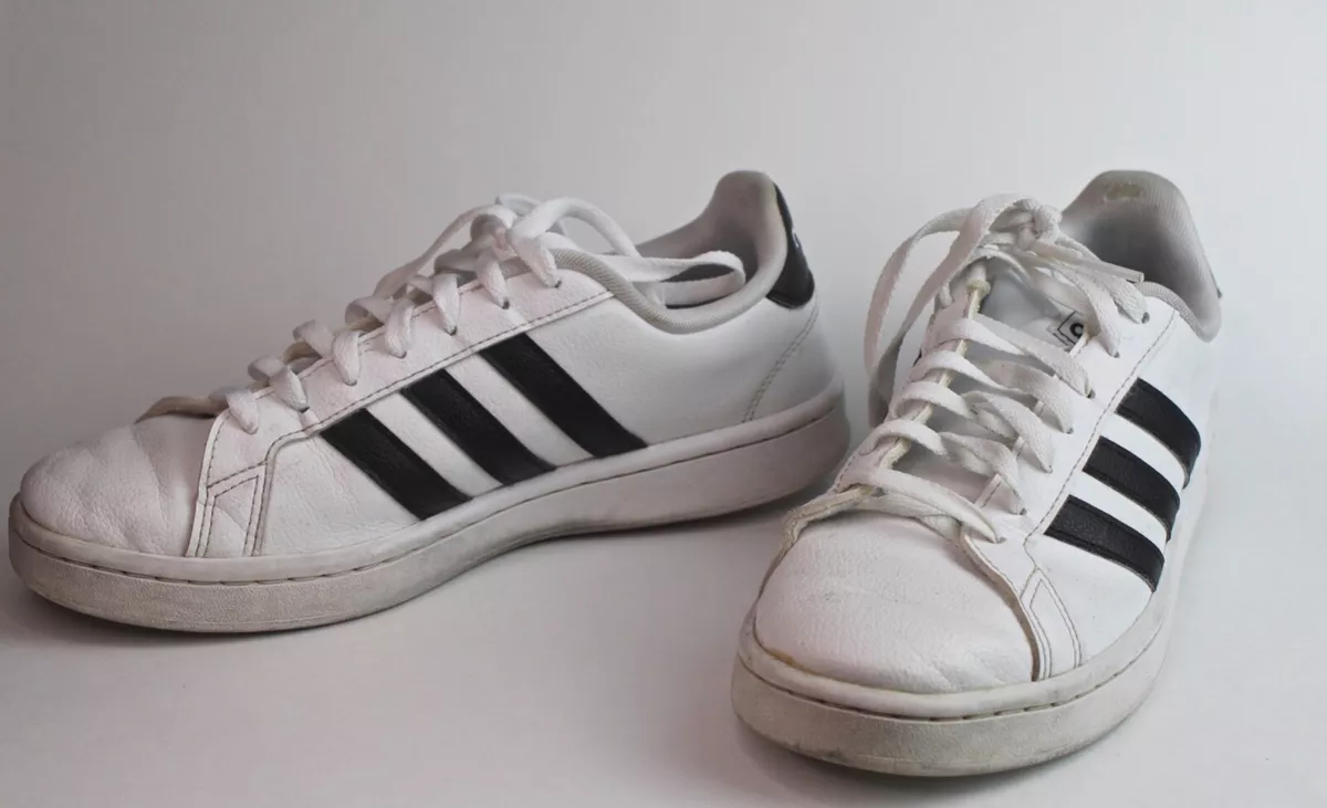 White sneakers with black stripes sale