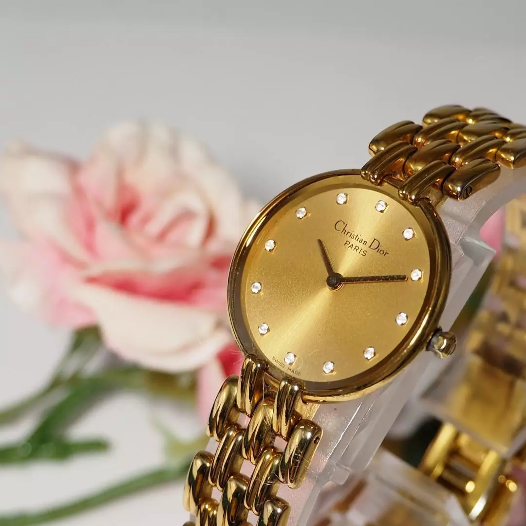 Montre femme Dior Bagilla 12P diamant boîtier et bracelet dorés, état de fonctionnement