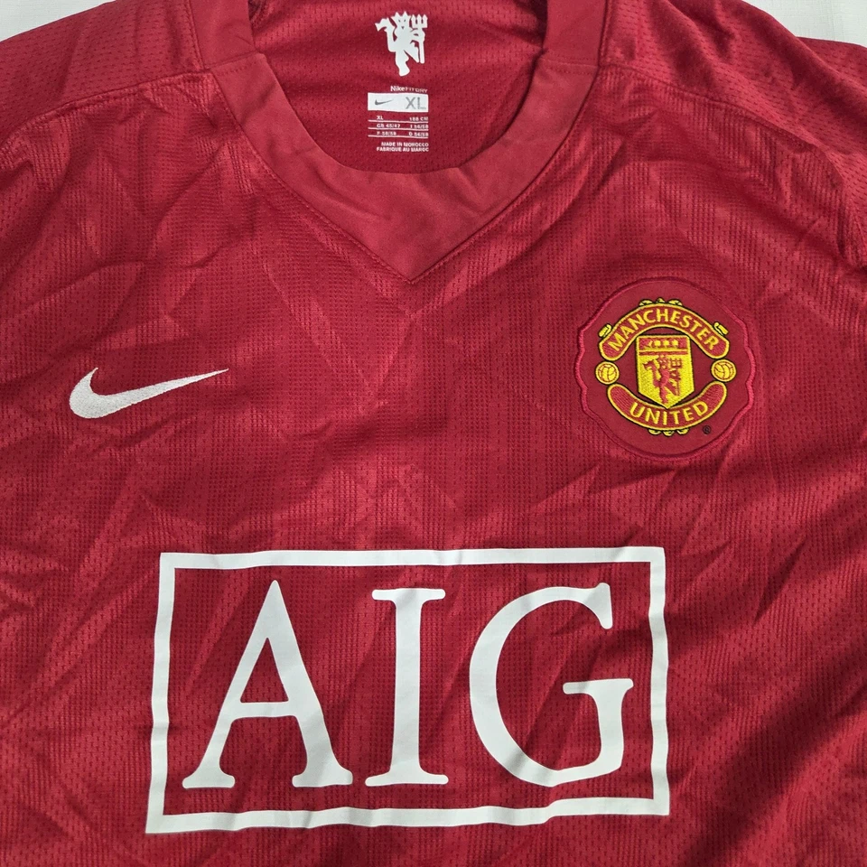 Camiseta de fútbol roja XL del Manchester United para hombre AIG NikeFIT seca Nike Foto 3 de 4