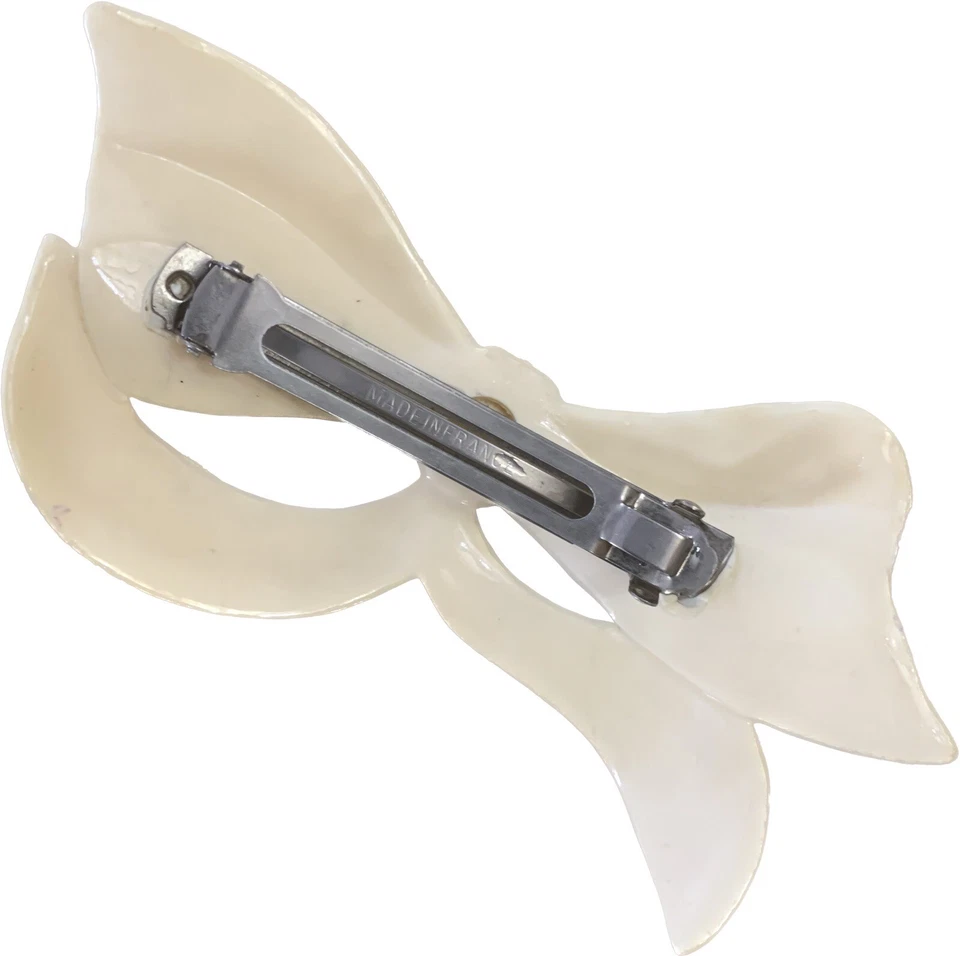 Boreta de arco de plástico beige marfil años 80 90 inusual vintage Foto 2 de 4