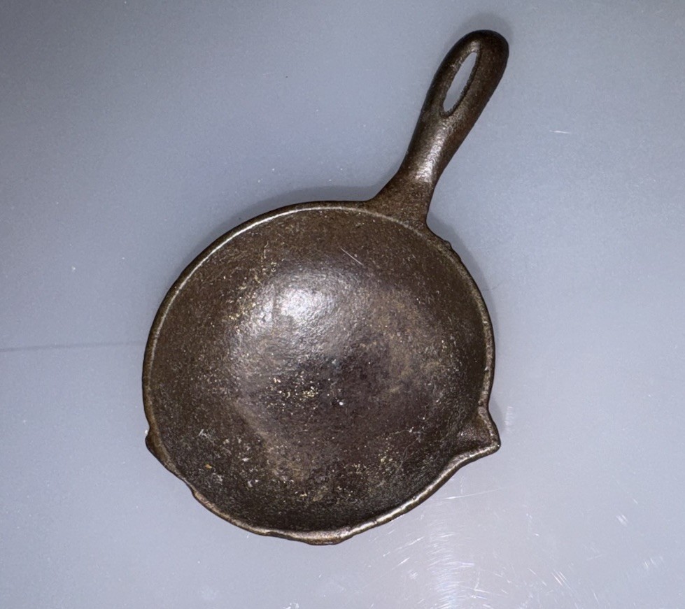 Small three-legged miniature cast iron spider skillet, novelty size