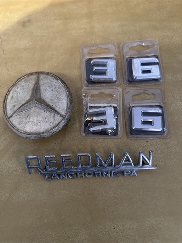 Mercedes Emblem, Car Numbers And A Dealer Emblem In Used Condition.