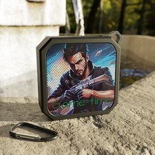 Blackwater Outdoor Bluetooth Speaker say game time with guy on it playing a game
