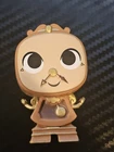 Vinyl Figure Of Cogsworth From Funko Mystery Mini Disney Princess & Sidekicks