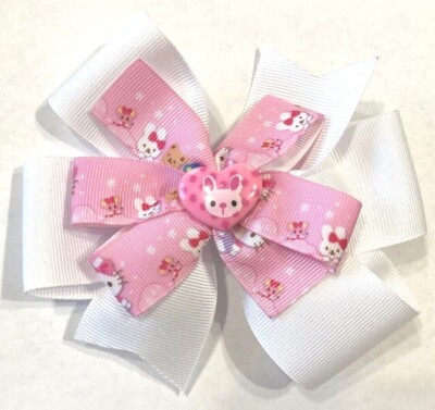 Beautiful Bunny on a pink heart inspired hair bow for girls. 