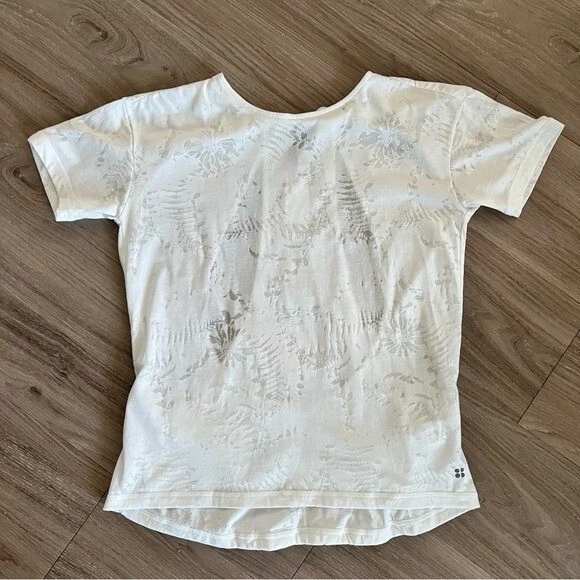 sweaty-betty burnout floral back cutouts shirt