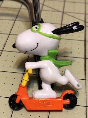 Peanuts Snoopy on Orange Scooter with Green Scarf & Glasses