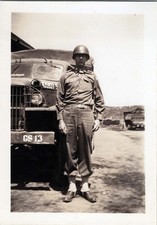 WW2 Photo Of 1 Soldier Full Length Beside Army Truck In Motor Pool