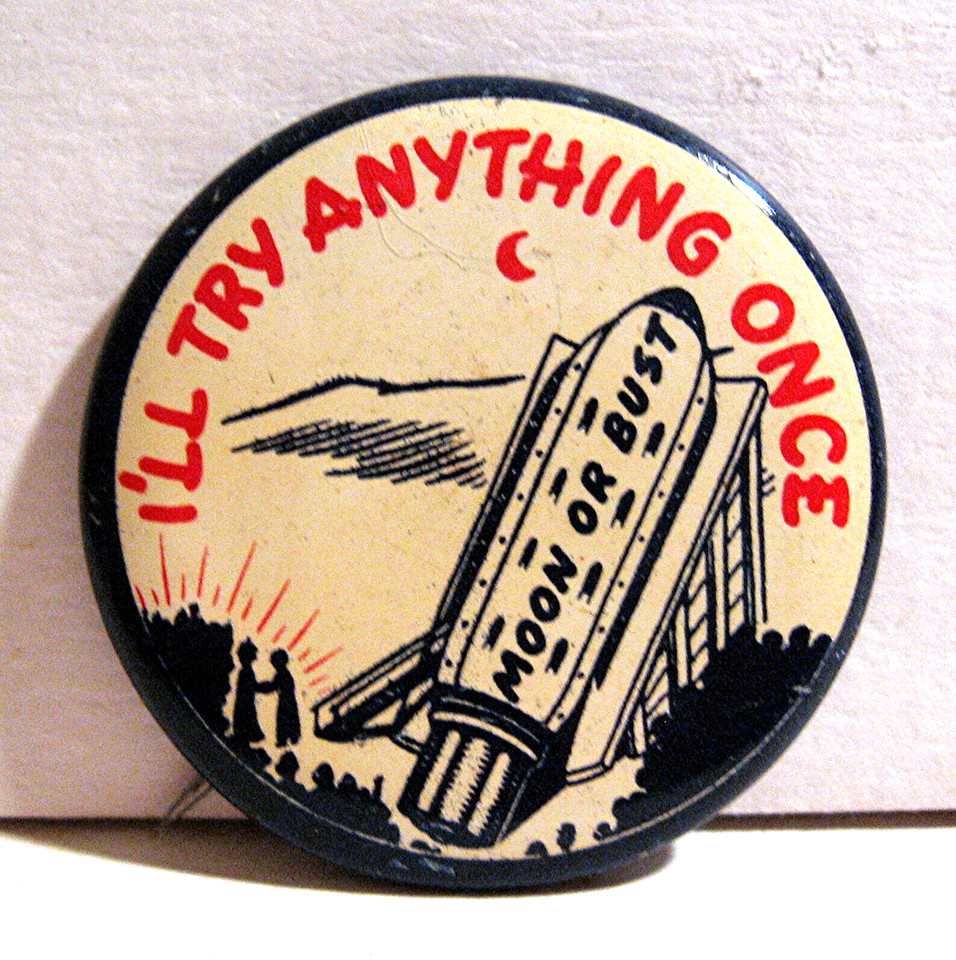 Old store stock 1940s–50s pinback button reading "Moon Or Bust" — pre-Apollo optimism captured in a tiny, hilarious relic of American ambition.