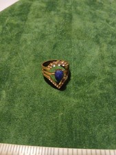 Gold Coloured Costume Ring With A Blue Center Stone