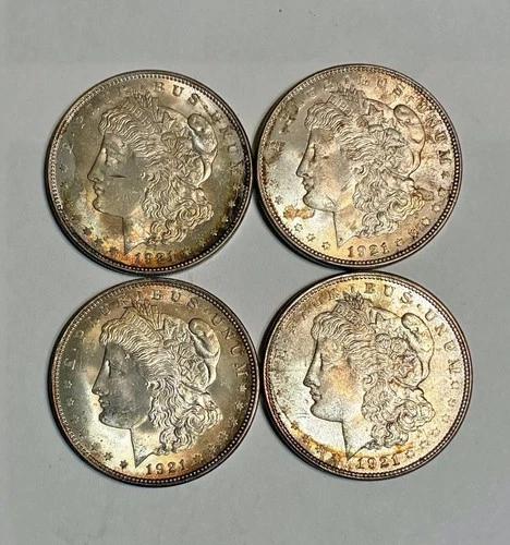 Lot of four 1921 Morgan silver dollars