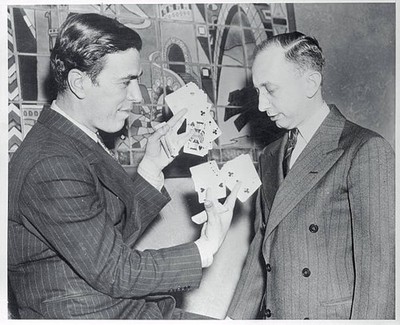 John Scarne is shown in this waist up photo with an unidentified m- Old Photo