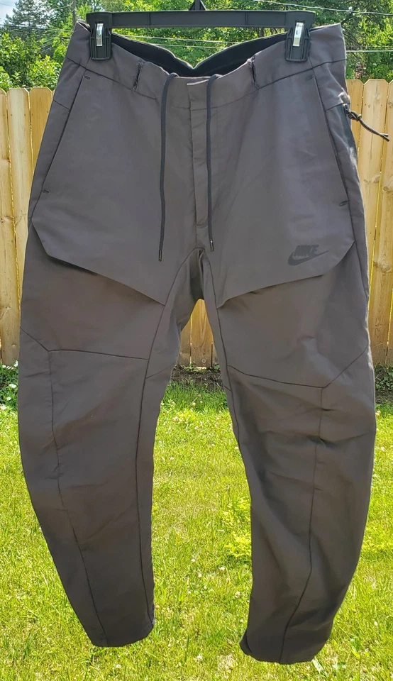 Pantalón Nike Para Hombres M Gris Tejido Carga Cónico Tech * LAZOS DE CINTURÓN RASGADOS Foto 2 de 4