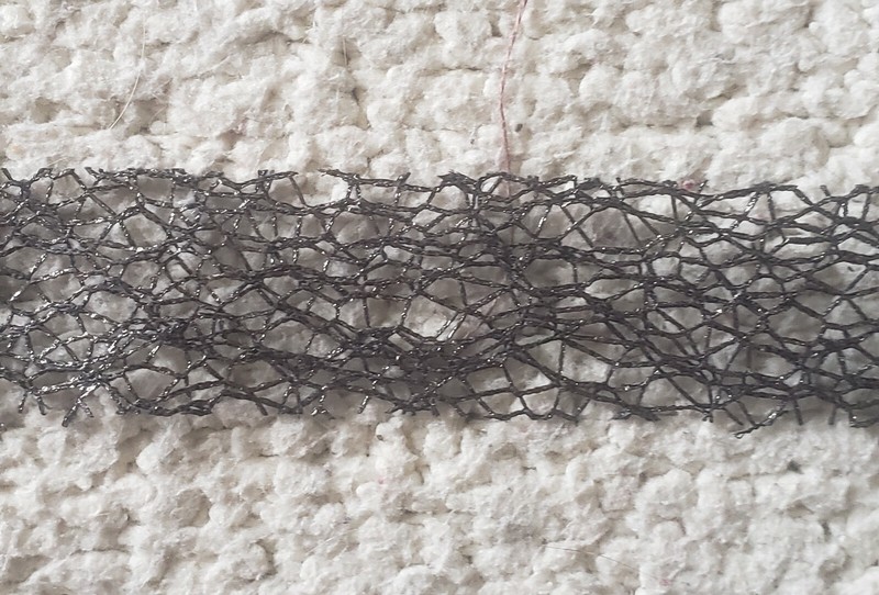2.5 yards of 7/8" wide black mesh ribbon used mainly for crafts