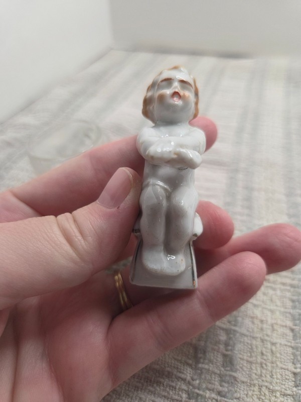 Vintage Japanese porcelain boy with crossed hands on potty with fedral glass mug