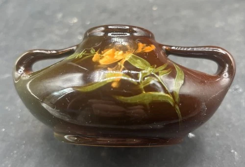 SIGNED WELLER LOUWELSA TWO HANDLED VASE BROWN GLAZE WITH FLORAL ACCENTS