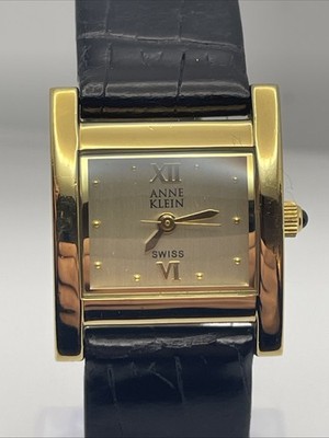 Anne Klein Swiss Gold Tone Women s Quartz Watch with a Black Leather Strap
