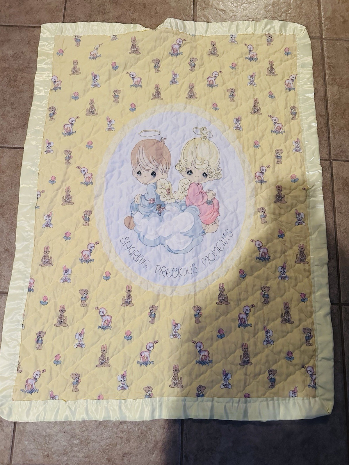 Handmade Precious Moments baby blanket with animal and cherub motifs.