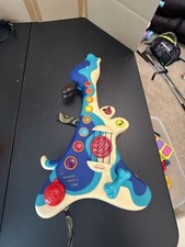 B. Toys B. Woofer Hound Dog Musical Guitar Toy